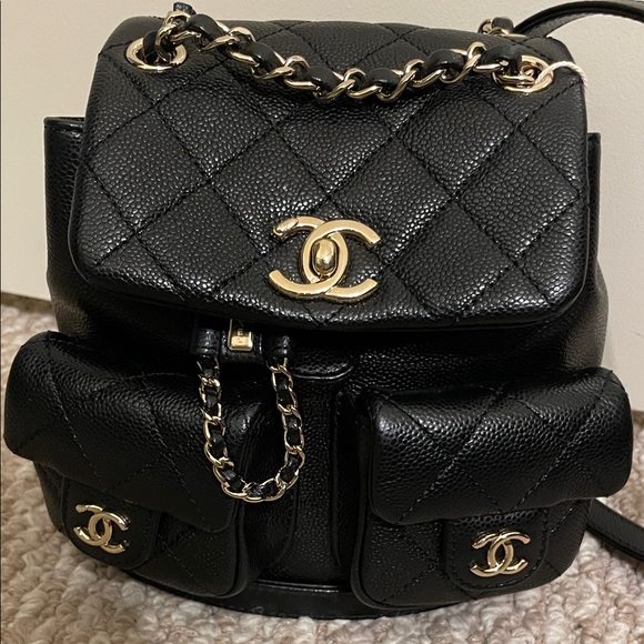 CHANEL Handbags - CHANEL Black Quilted Backpack with Gold Accents